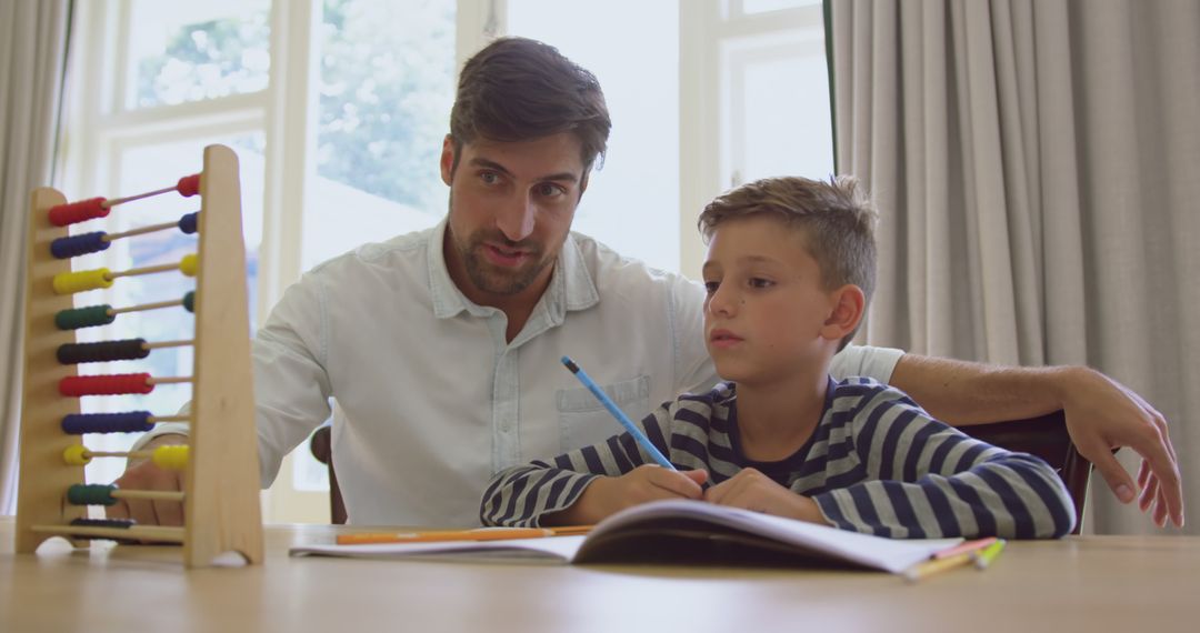 Father Helping Son with Homework Using Abacus - Free Images, Stock Photos and Pictures on Pikwizard.com