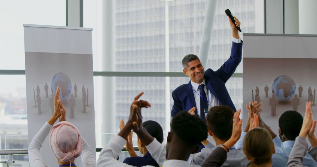 A Caucasian businessman celebrates success to applause at a business seminar in 4k. - Free Images, Stock Photos and Pictures on Pikwizard.com