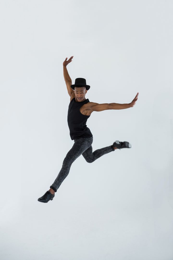Male Dancer Performing Leap in Studio - Free Images, Stock Photos and Pictures on Pikwizard.com