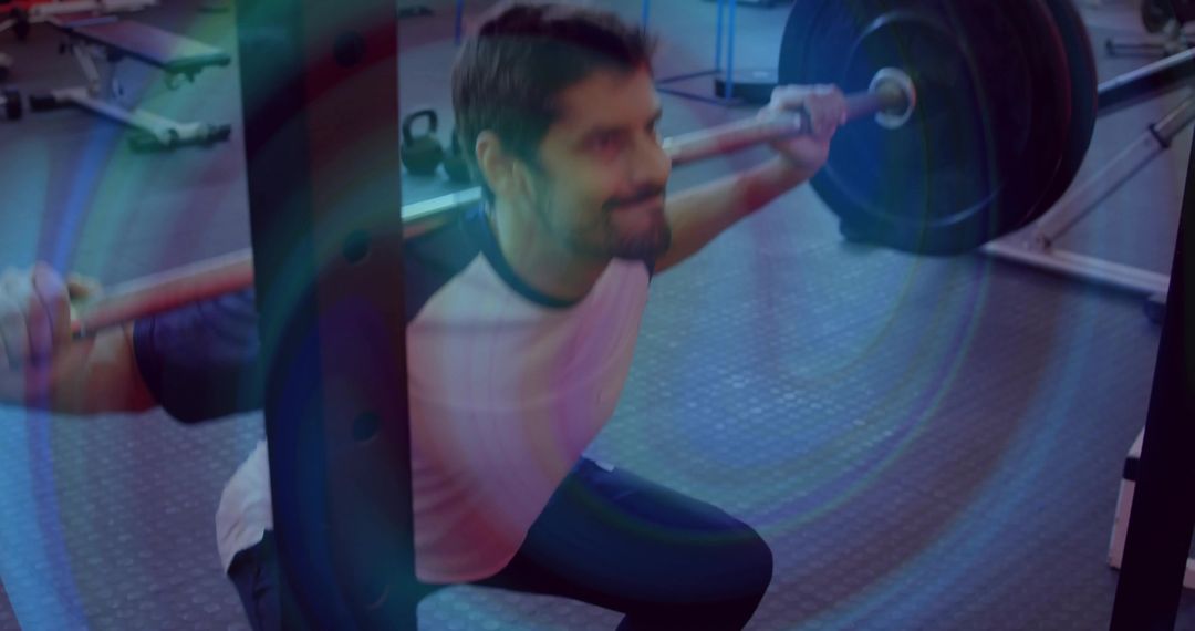 Man Performing Heavy Back Squat with Barbell Near Squat Rack