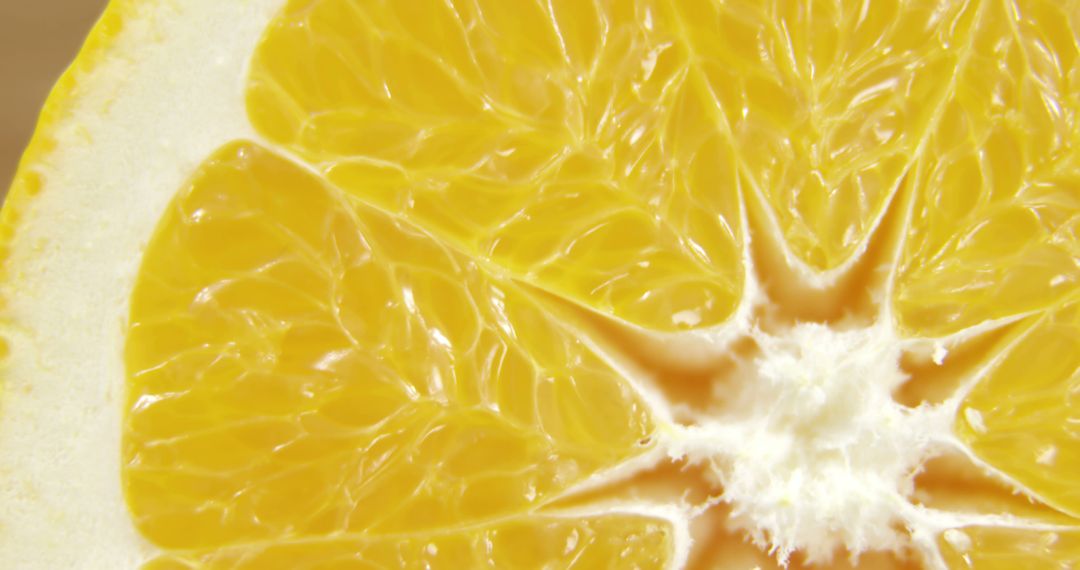 Close-up of Freshly Cut Grapefruit Slice Showing Vivid Pulp Texture - Free Images, Stock Photos and Pictures on Pikwizard.com