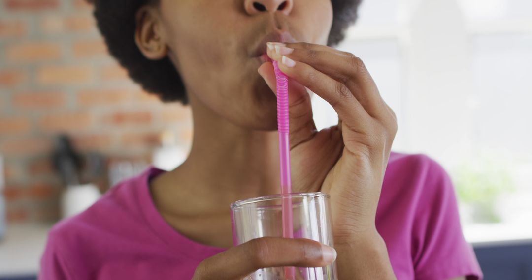 Close-up of Woman Drinking from Straw in Glass - Free Images, Stock Photos and Pictures on Pikwizard.com