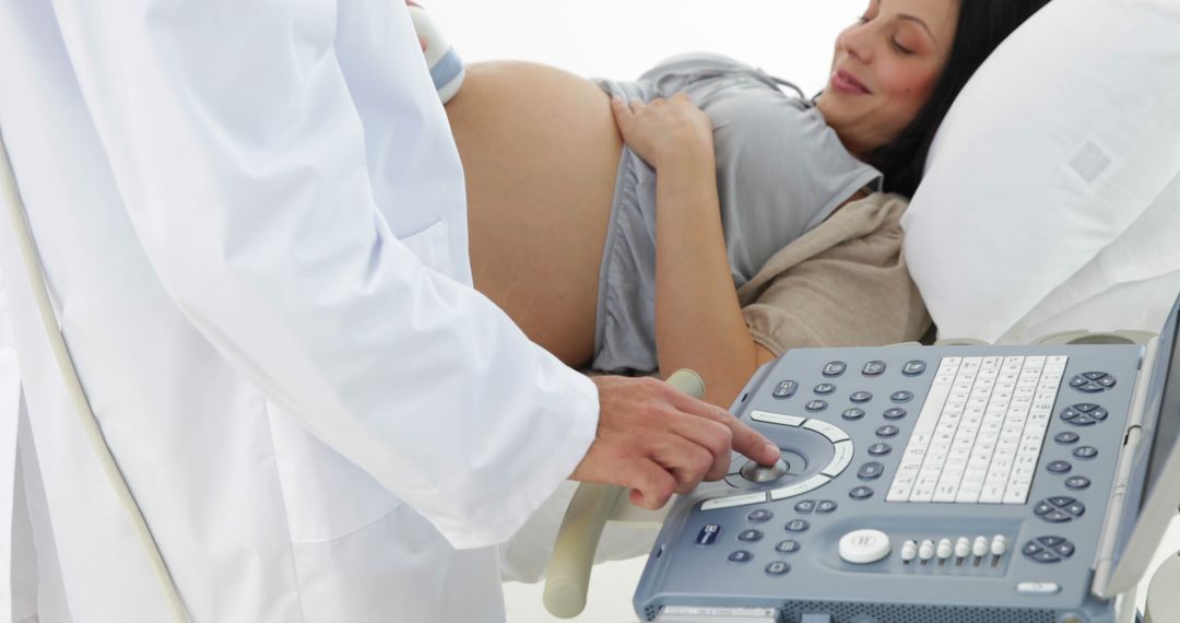 Pregnant Woman Receiving Ultrasound Examination from Doctor - Free Images, Stock Photos and Pictures on Pikwizard.com