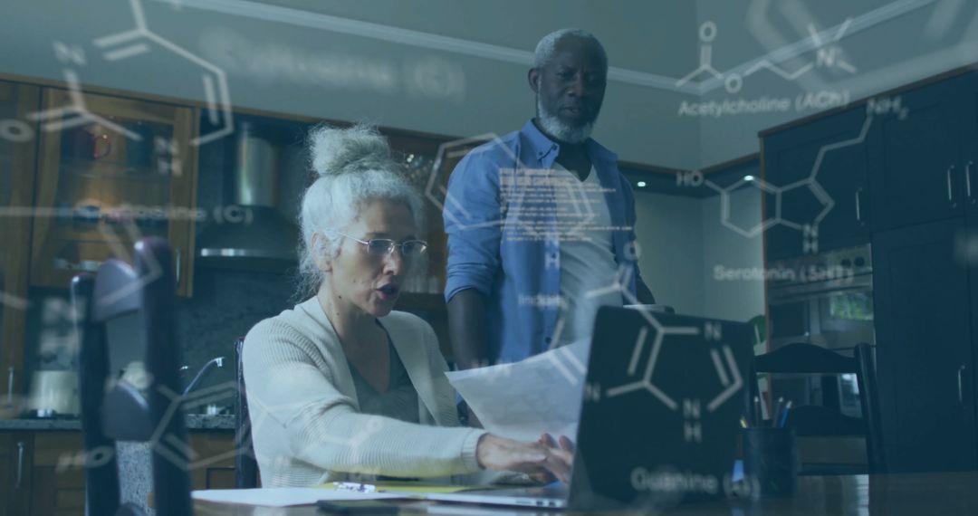 Senior Scientists Collaborating on Research Project Amid Chemical Formulas