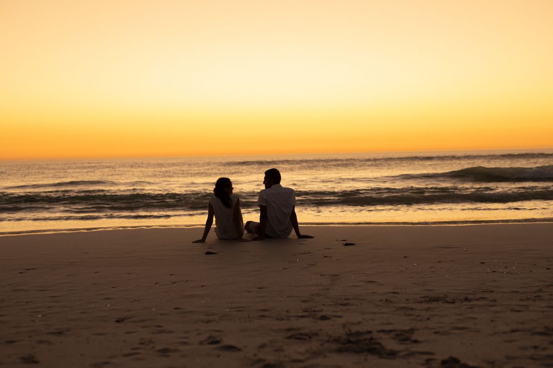Couple Enjoying Sunset on Beach - Free Images, Stock Photos and Pictures on Pikwizard.com