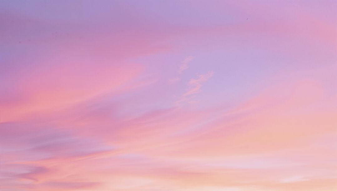 Serene Dawn Pastel Sky with Wispy Clouds