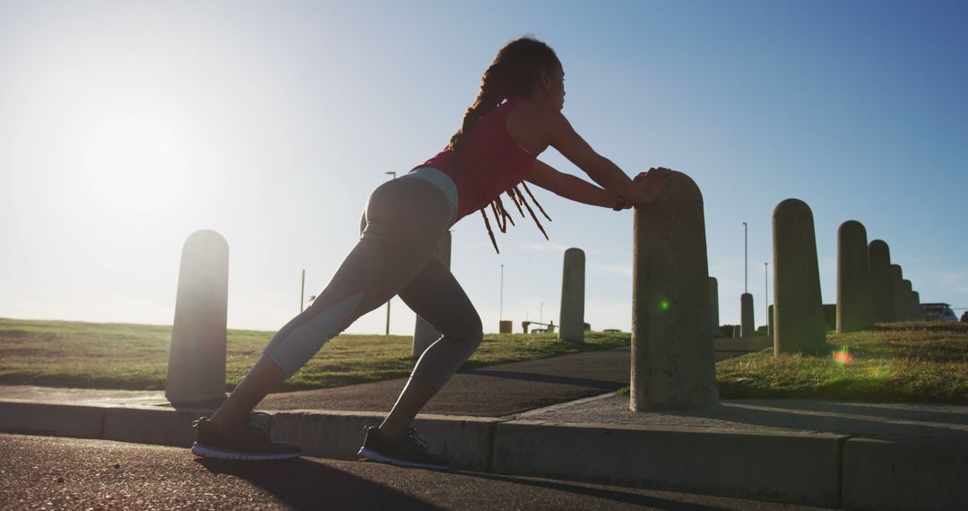 Woman Stretching Before Morning Run at Sunrise - Free Images, Stock Photos and Pictures on Pikwizard.com