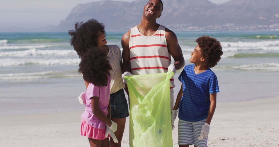 Happy Family Cleaning Beach Together - Free Images, Stock Photos and Pictures on Pikwizard.com