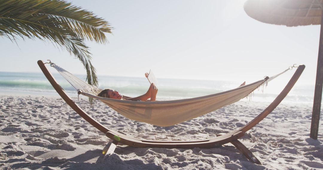 Woman Relaxing in Hammock at Tropical Beach - Free Images, Stock Photos and Pictures on Pikwizard.com
