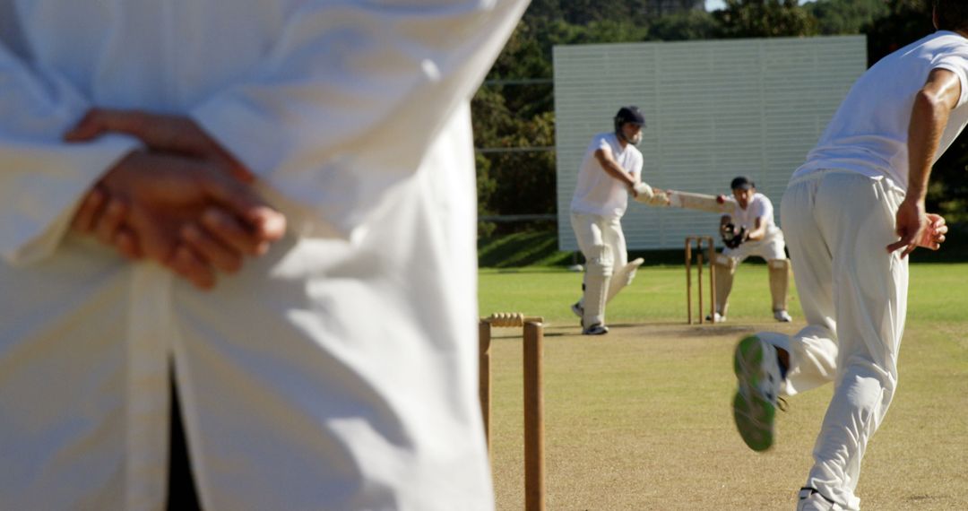 Cricket Players Competing on Field During Match - Free Images, Stock Photos and Pictures on Pikwizard.com