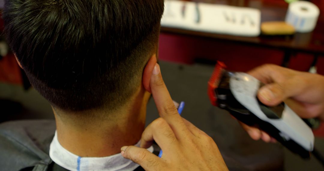 Barber Giving Modern Fade Haircut to Male Client - Free Images, Stock Photos and Pictures on Pikwizard.com