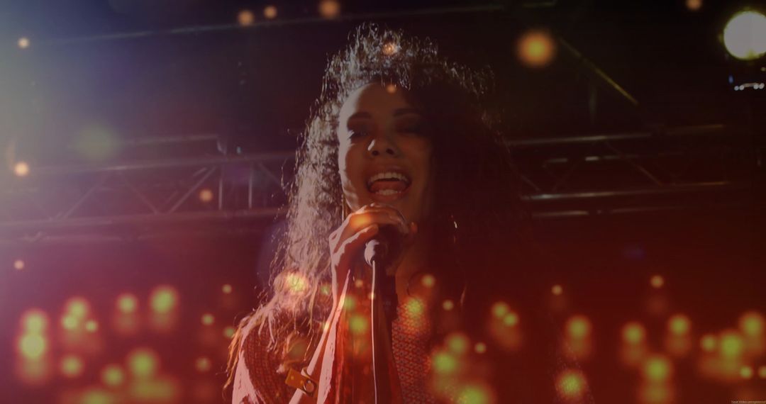 Female Singer Performing Live on Stage with Dramatic Lighting Effects