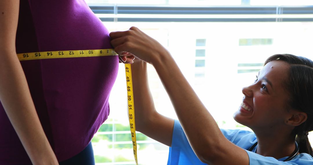 Pregnant Woman Getting Waistline Measured by Friendly Nurse - Free Images, Stock Photos and Pictures on Pikwizard.com