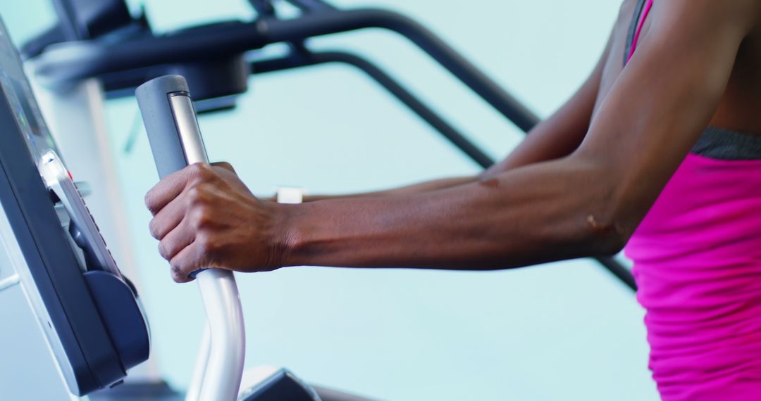 Closeup of Person Exercising on Elliptical Trainer - Free Images, Stock Photos and Pictures on Pikwizard.com