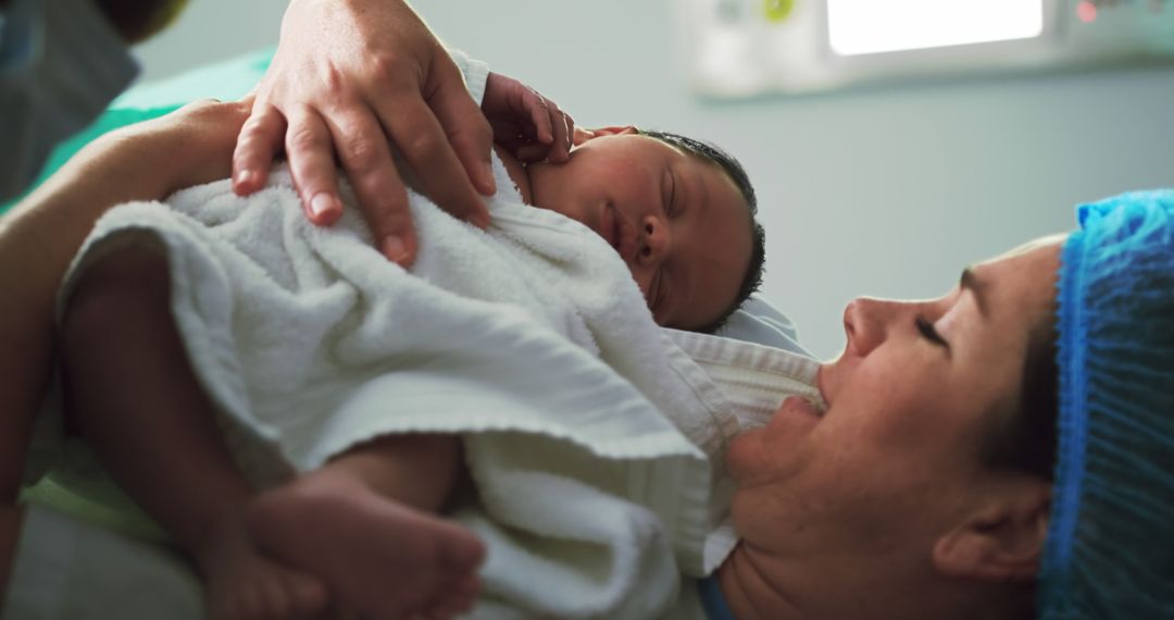 Mother Holding Newborn Baby After Birth in Hospital - Free Images, Stock Photos and Pictures on Pikwizard.com