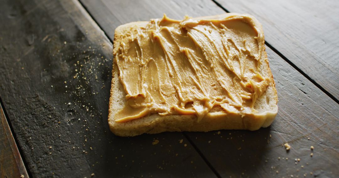 Close-Up of Peanut Butter Spread on Rustic Toast