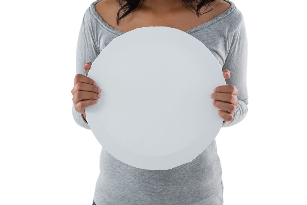 Mid section of woman holding circle shaped placard - Free Images, Stock Photos and Pictures on Pikwizard.com