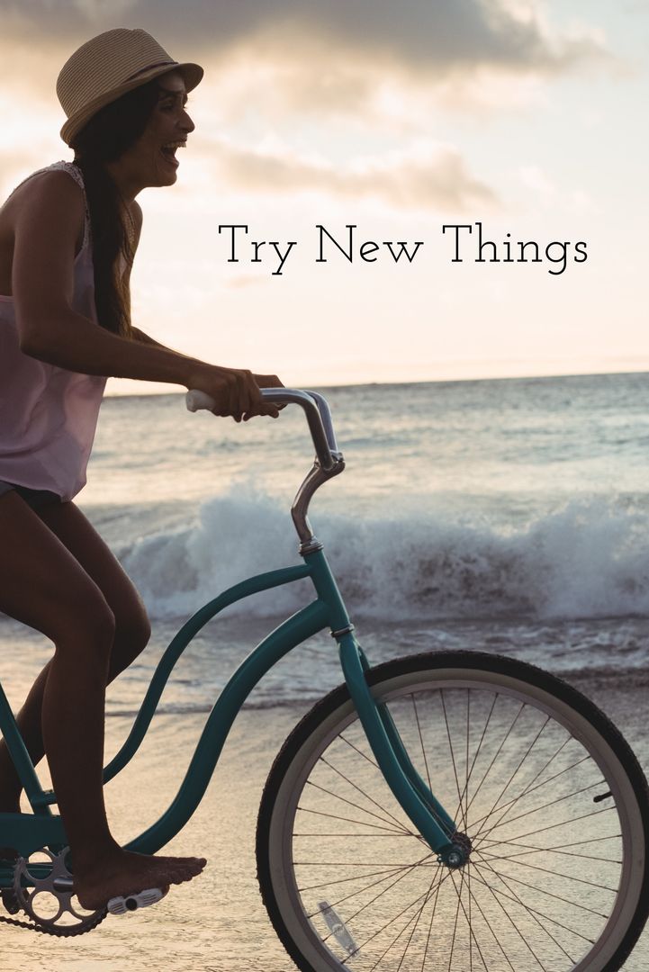 Woman Riding Bicycle on Beach at Sunset Promoting New Experiences