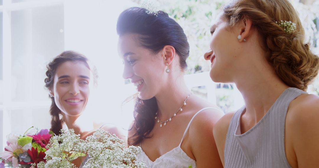 Bride with Bridesmaids Smiling and Holding Bouquet - Free Images, Stock Photos and Pictures on Pikwizard.com