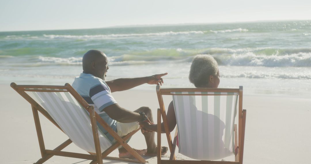 Elderly Couple Relaxing on Beach Chairs by the Ocean - Free Images, Stock Photos and Pictures on Pikwizard.com