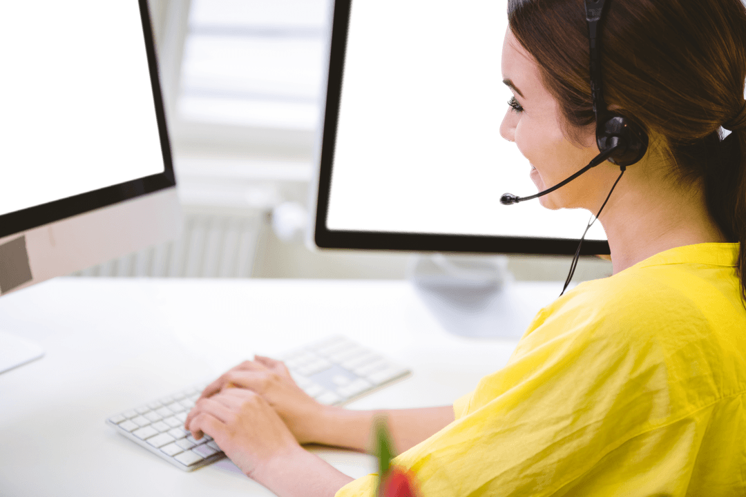 Smiling Woman Using Headset and Computer with Transparent Screens