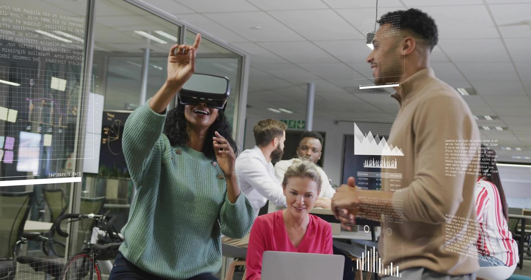 Hispanic woman using VR headset demonstrating holographic data with team in modern office