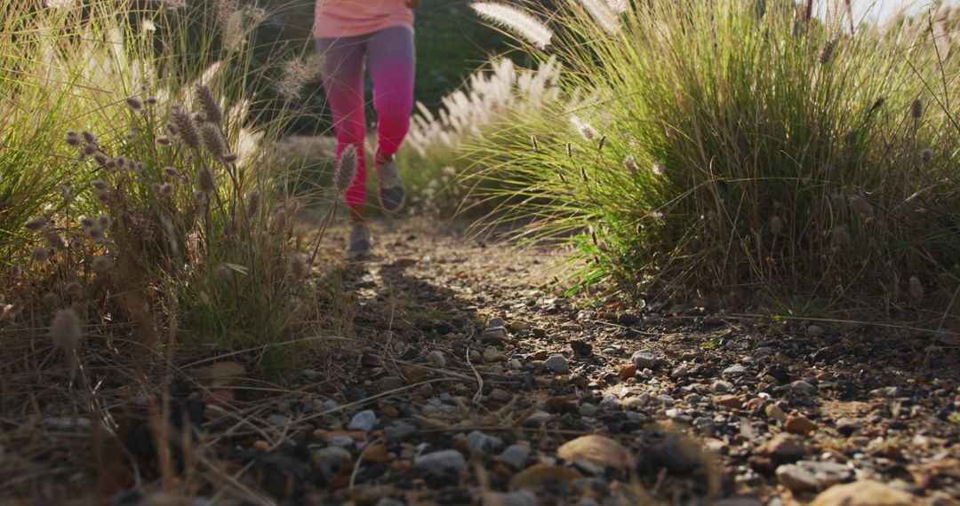 Person Jogging on Trail through Grassy Field - Free Images, Stock Photos and Pictures on Pikwizard.com