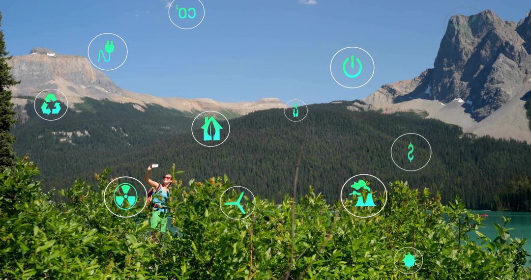 Explorer with Smartphone and Eco Icons in Mountainous Terrain