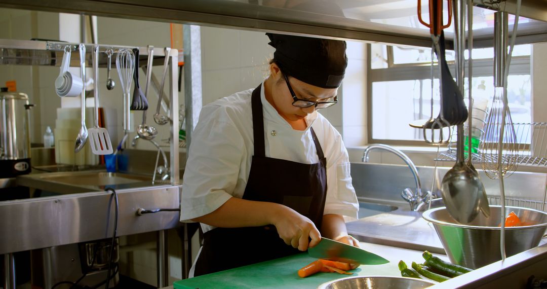 Female Chef Preparing Vegetables in Professional Kitchen - Free Images, Stock Photos and Pictures on Pikwizard.com