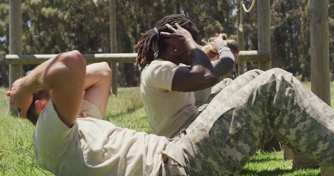 Diverse Soldiers Exercising on Army Obstacle Course Outdoors