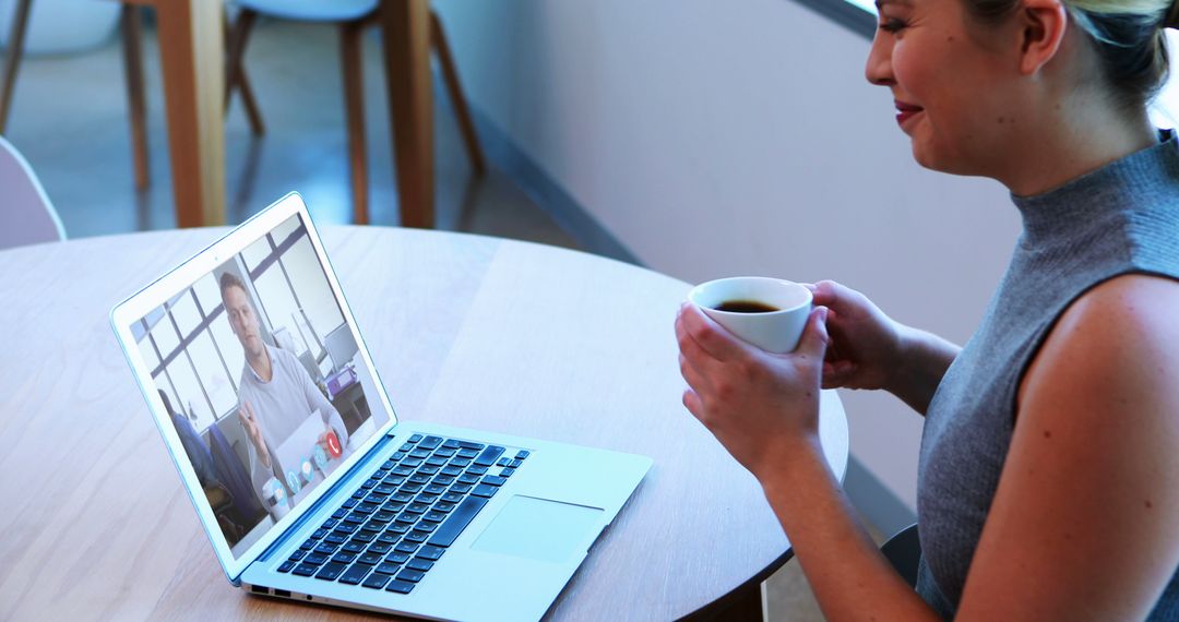 Woman Having Video Call with Coffee at Home - Free Images, Stock Photos and Pictures on Pikwizard.com