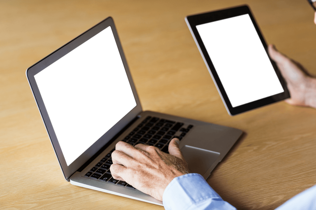 Person Manipulating Transparent Devices at Workdesk