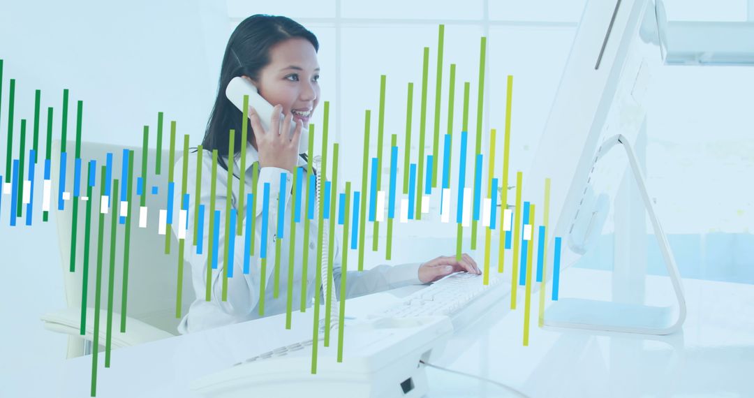 Businesswoman Analyzing Data on Computer with Phone