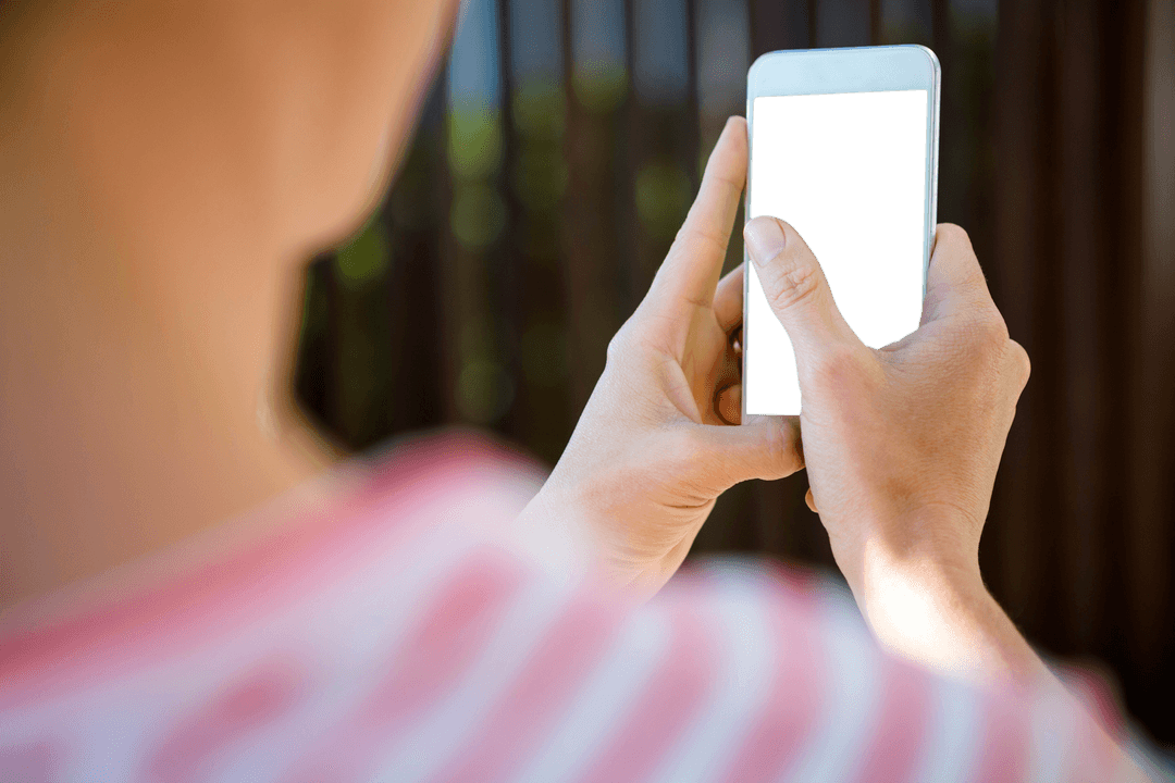 Transparent Screen Smartphone Being Used by Woman's Hands Outdoors