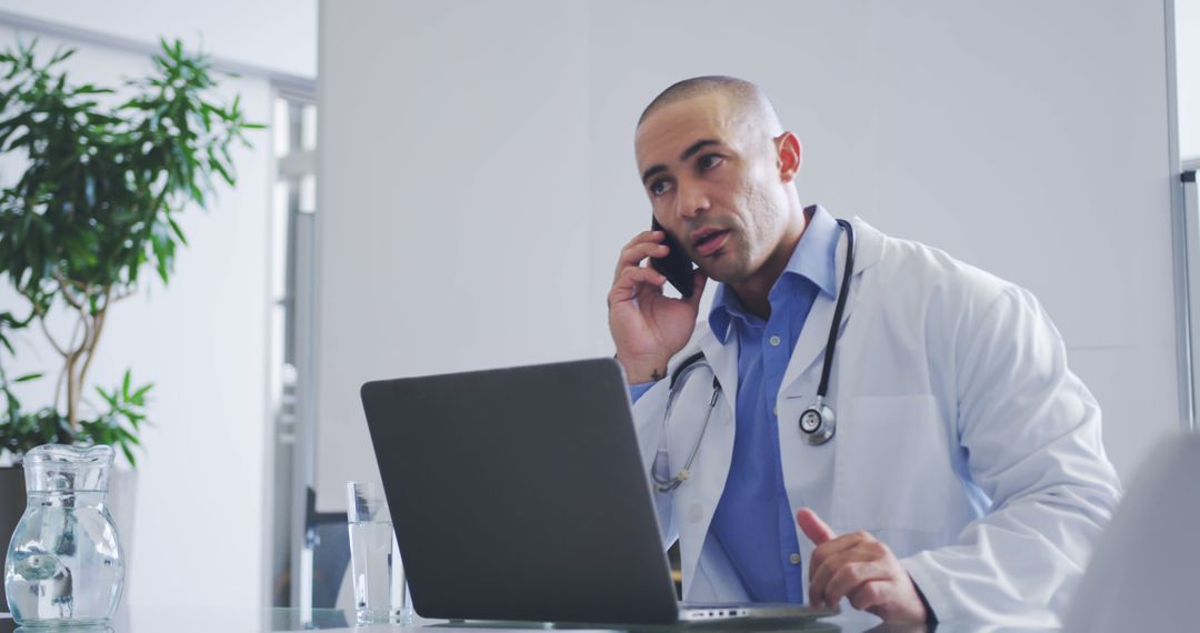 Caucasian Male Doctor Talking on Phone in Office - Free Images, Stock Photos and Pictures on Pikwizard.com