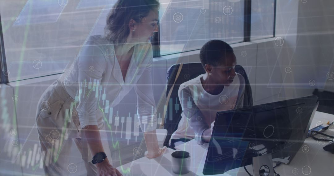 Women Collaborating on Data Analytics in Modern Office