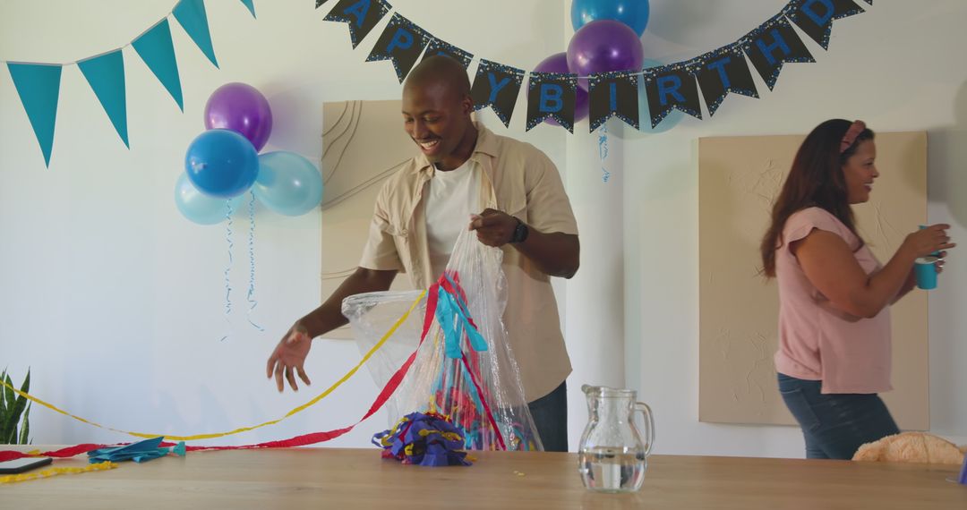 Birthday Party Decoration with Colorful Streamers and Joyful Teamwork