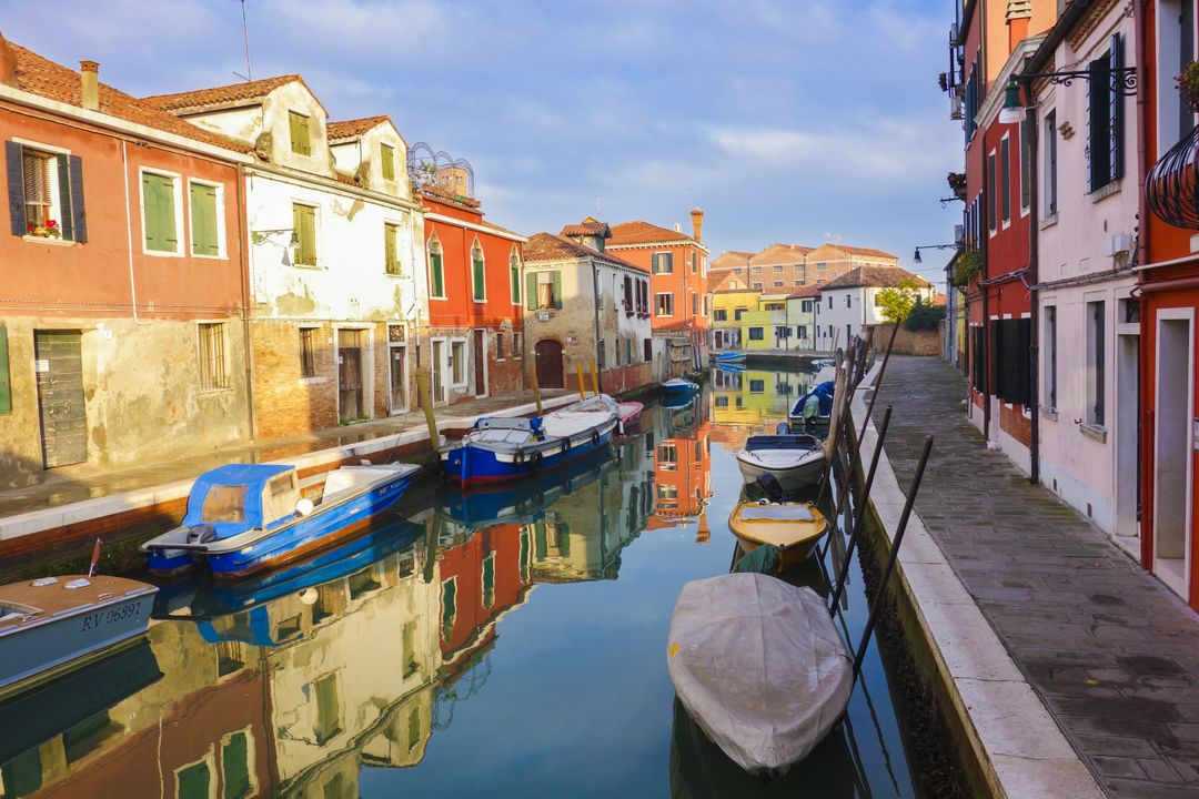 Colorful Houses and Boats in Serene Canal, Burano, Italy - Free Images, Stock Photos and Pictures on Pikwizard.com