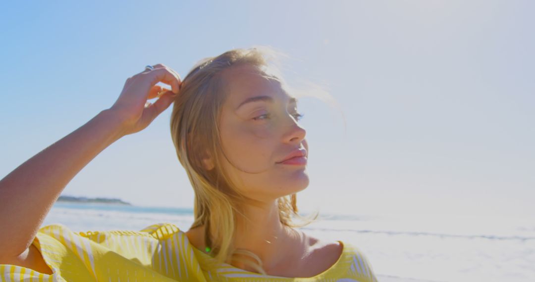 Woman Enjoying Sunshine on Beach, Radiating Confidence and Joy - Free Images, Stock Photos and Pictures on Pikwizard.com