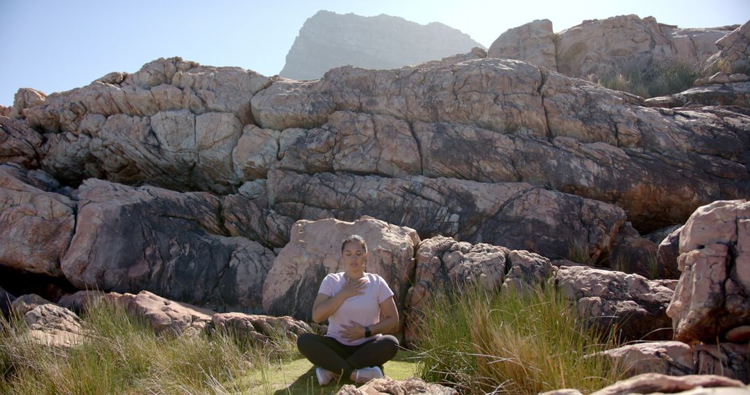 Woman Resting and Contemplating Nature on Mountain Rocks