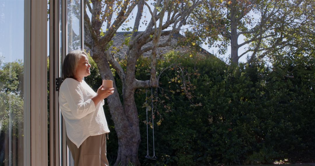 Senior Woman Enjoying Morning Coffee Outdoors