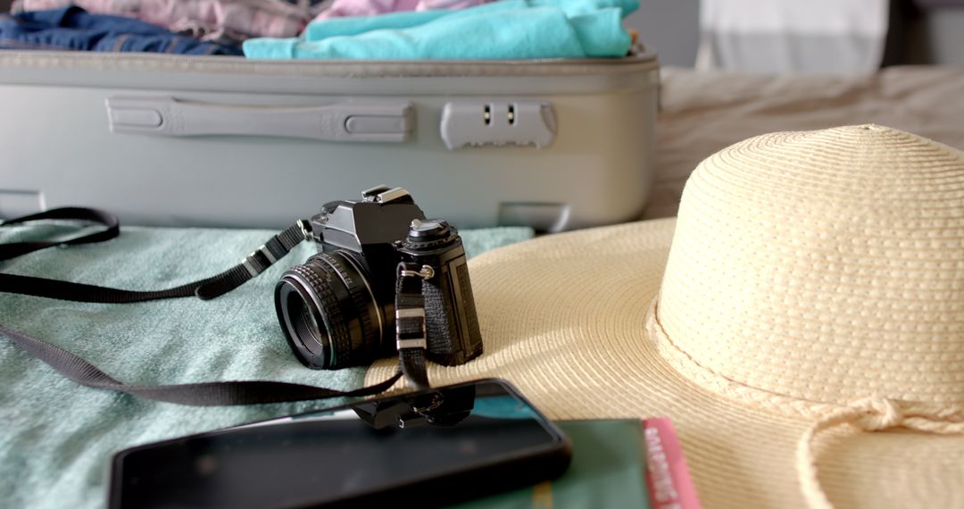 Preparation for Travel with Vintage Camera and Summer Hat