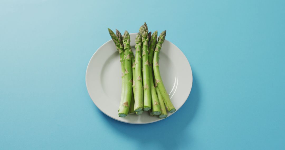 Fresh Asparagus Spears on White Plate Background - Free Images, Stock Photos and Pictures on Pikwizard.com