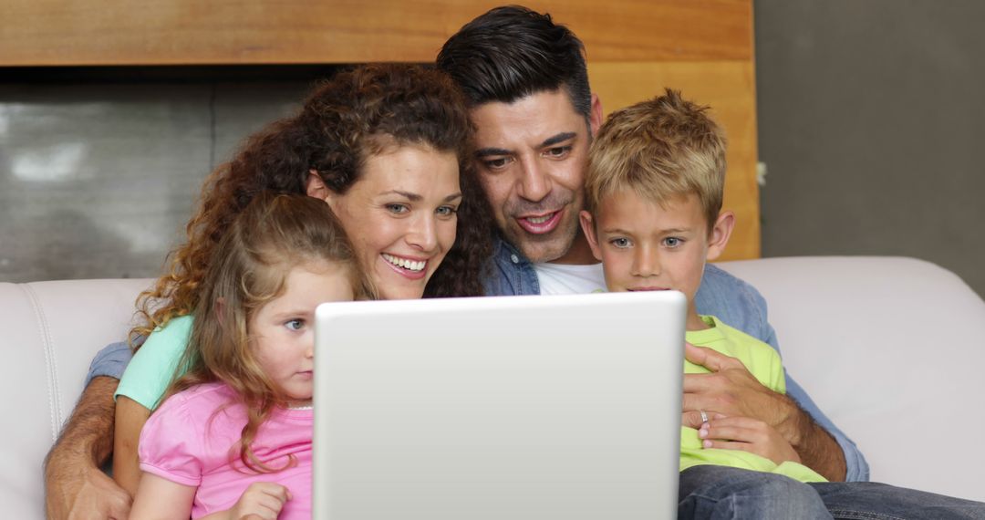 Happy Family Watching Movie on Laptop Together at Home - Free Images, Stock Photos and Pictures on Pikwizard.com