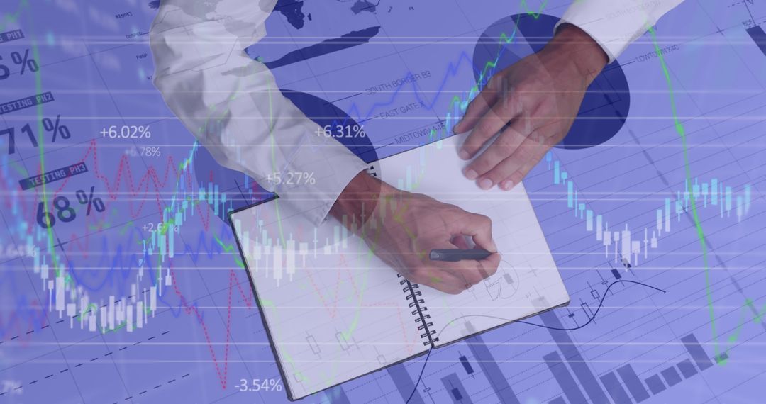 Man Analyzing Financial Statistics and Writing in Notebook