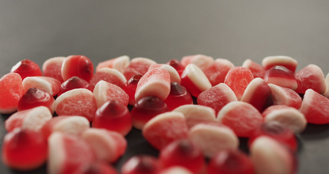 Assorted Red and Pink Gummies on Gray Surface - Free Images, Stock Photos and Pictures on Pikwizard.com