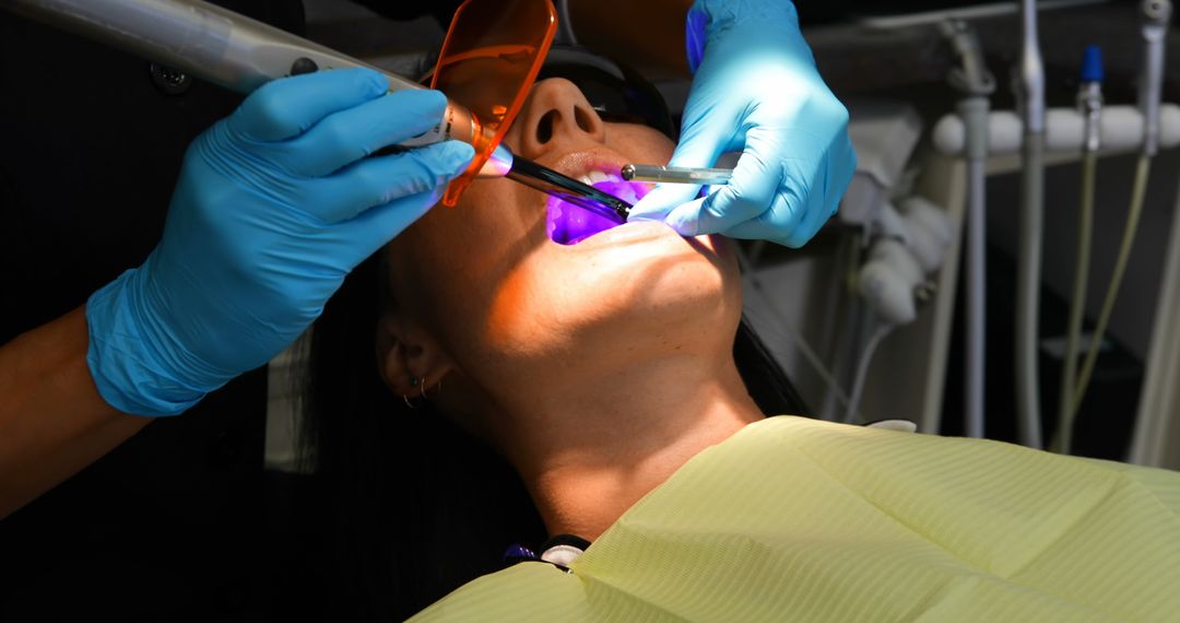 Dentist Performing Oral Surgery with Laser on Patient - Free Images, Stock Photos and Pictures on Pikwizard.com