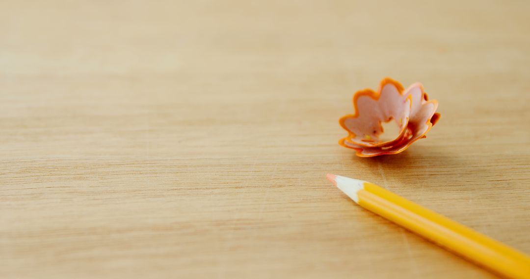 Pencil and Orange Flower Candle Holder on Wooden Surface - Free Images, Stock Photos and Pictures on Pikwizard.com