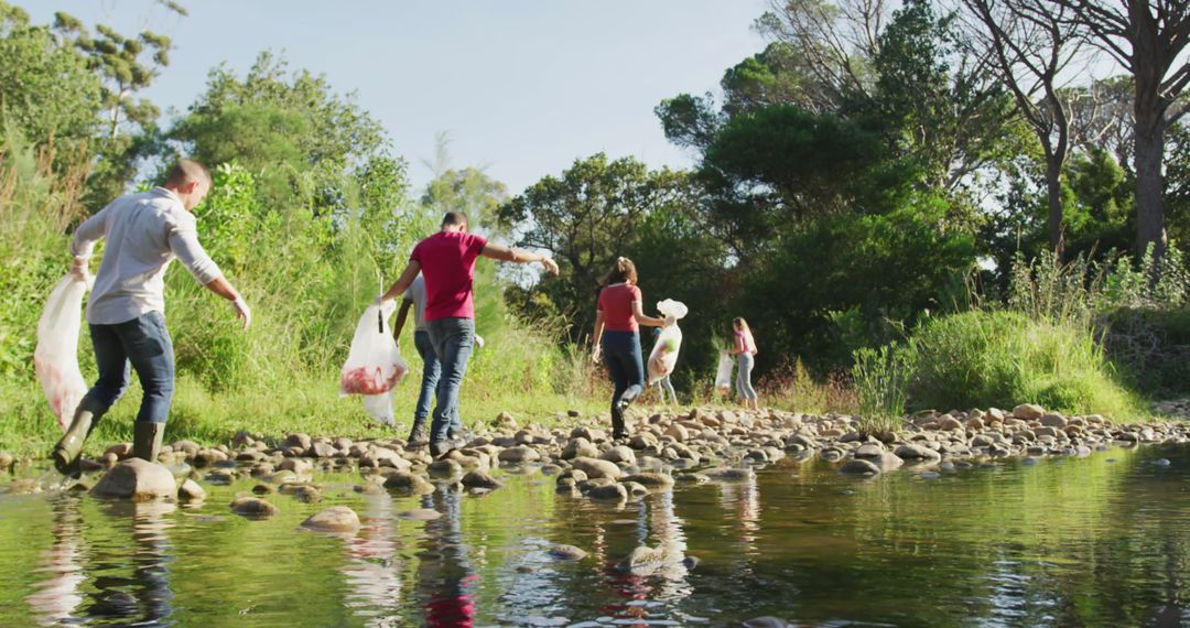 Volunteers Collecting Trash in Riverside Nature Cleanup