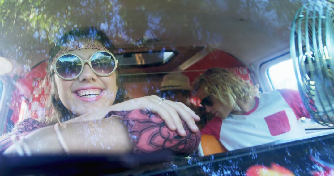 Happy Friends Enjoying Road Trip in Retro Van